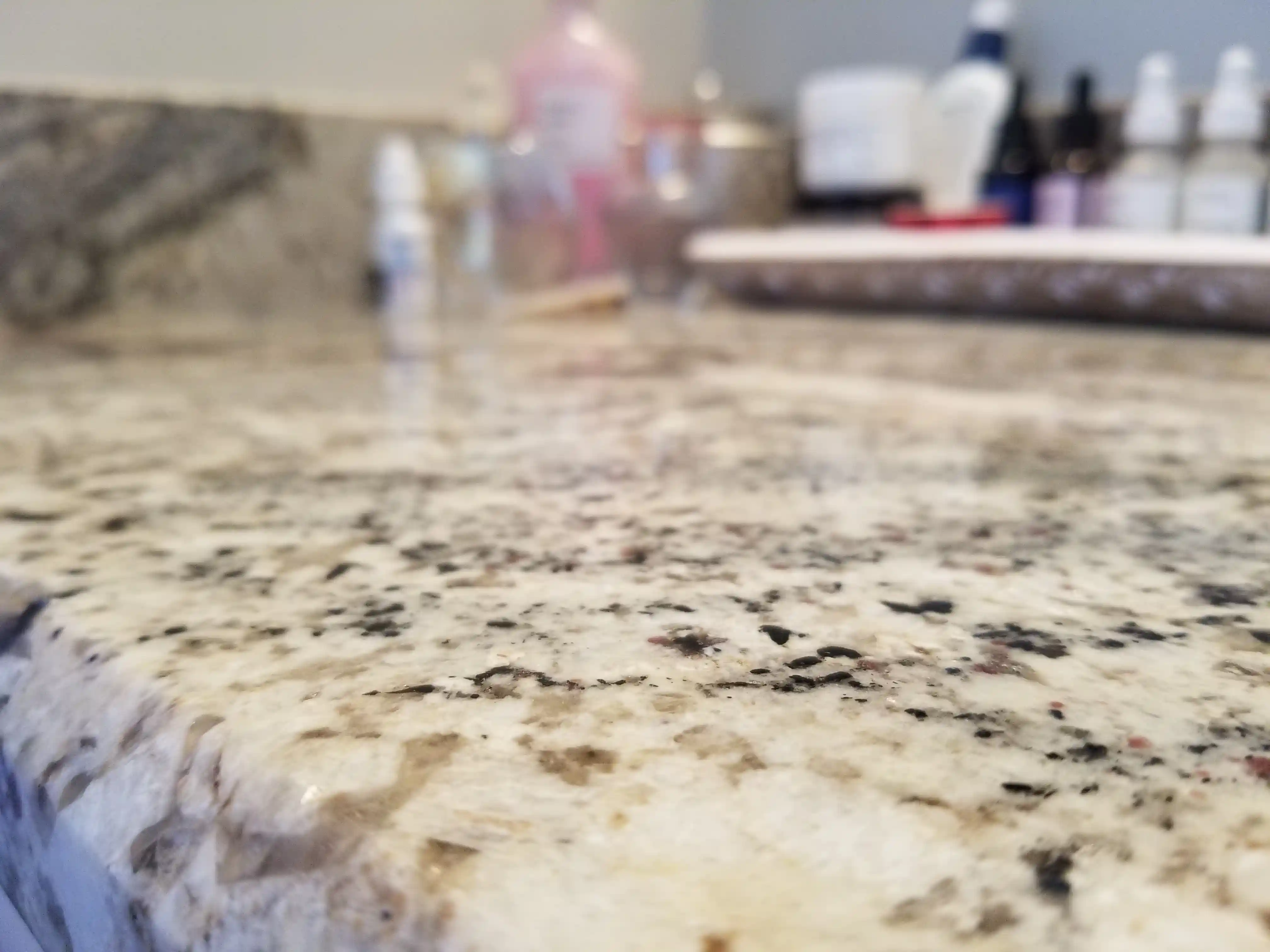 Close up photo of bathroom granite countertop.